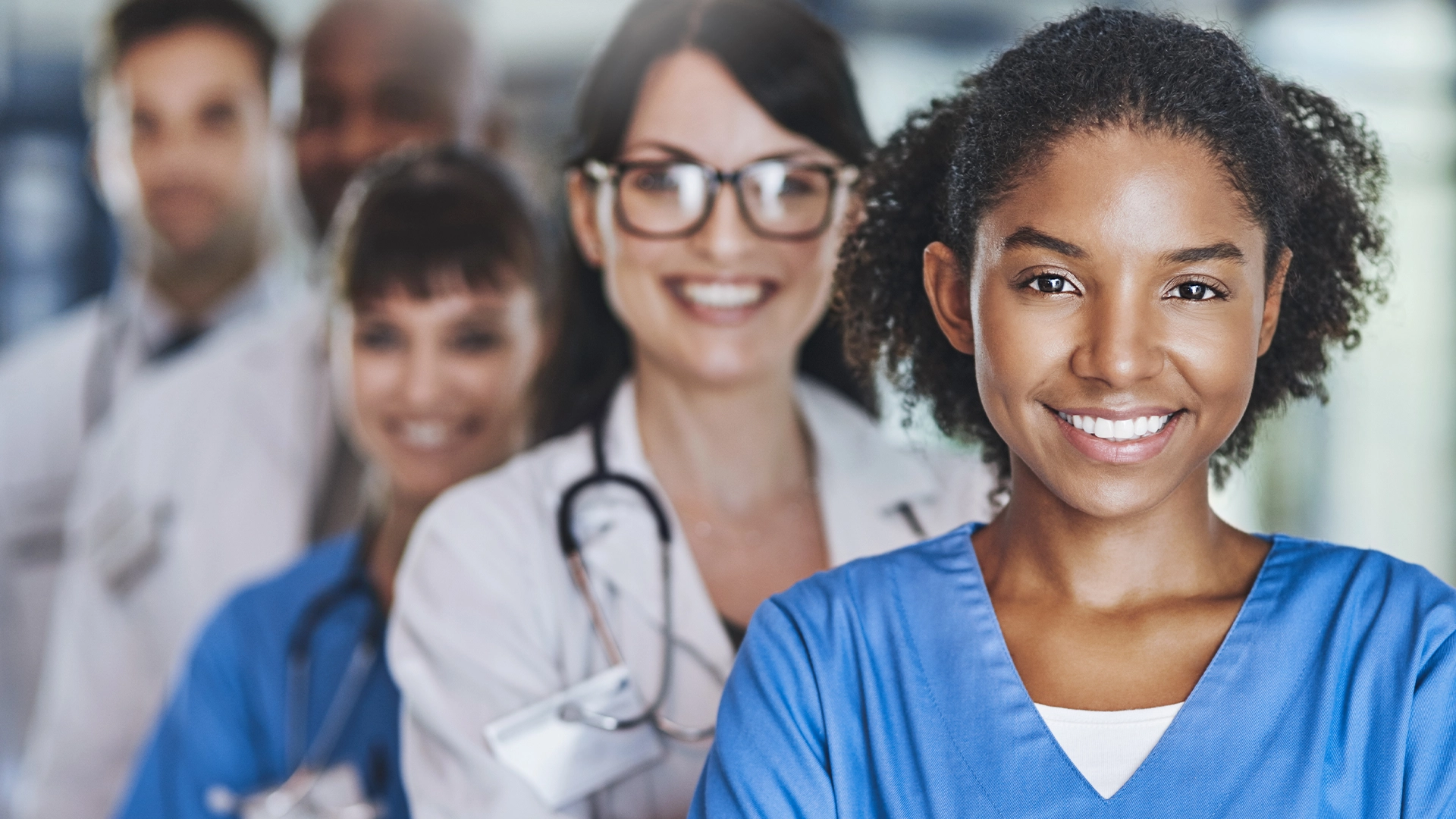 Smiling healthcare professionals, men and women