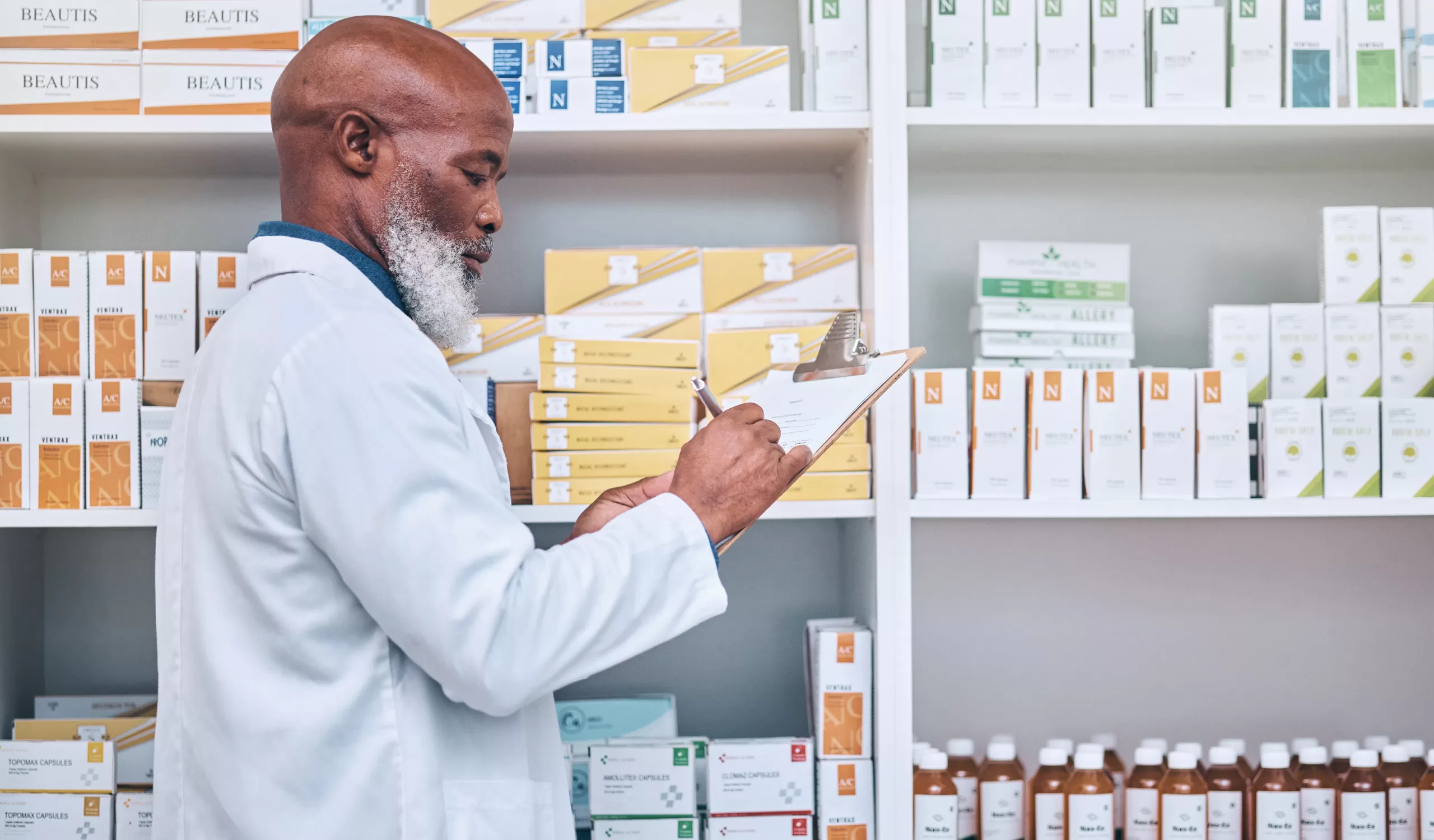 Pharmacist checking pharmaceutical inventory