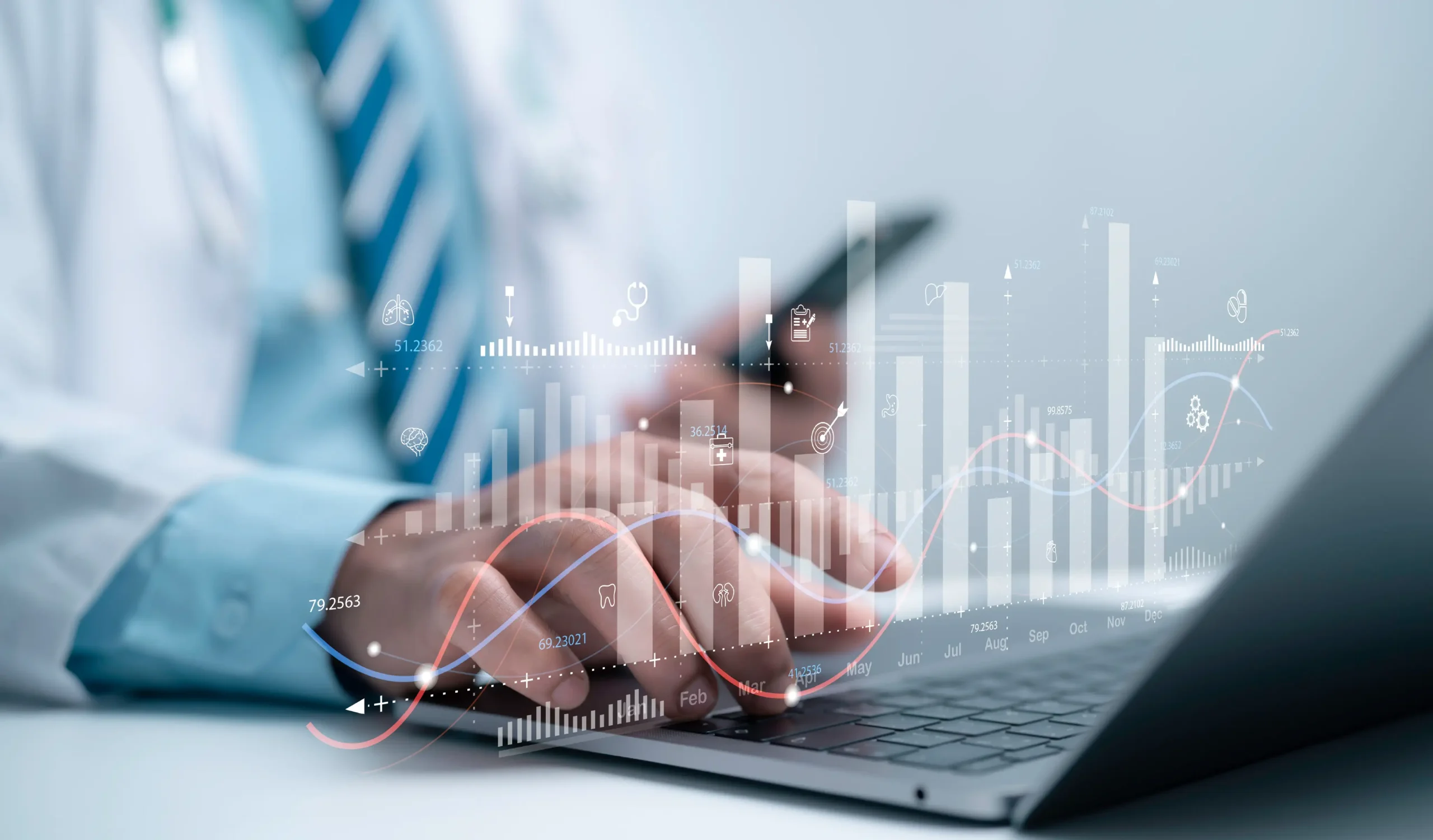Healthcare worker looking at analytics on laptop.